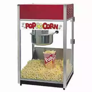 Pop corn machine with popped kernels and a container in side