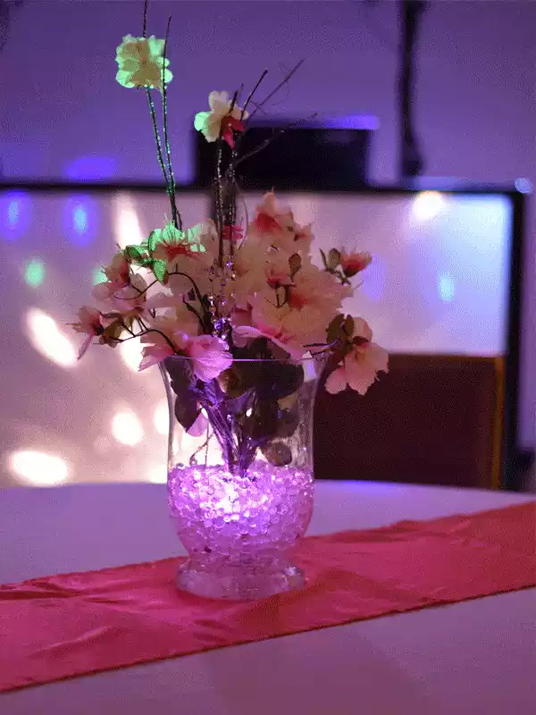 Floral centerpiece with gel beads in a vase