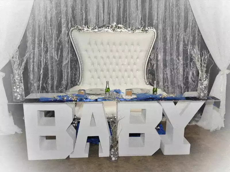 Baby shower decor head table with backdrop curtains and BABY table base