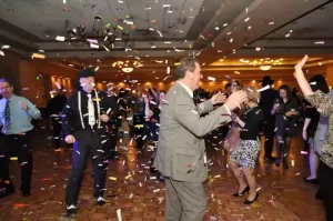 Confetti falling on dancers at a corporate party