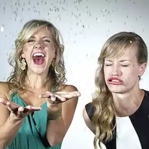 Two women making faces in a slow motion photo booth