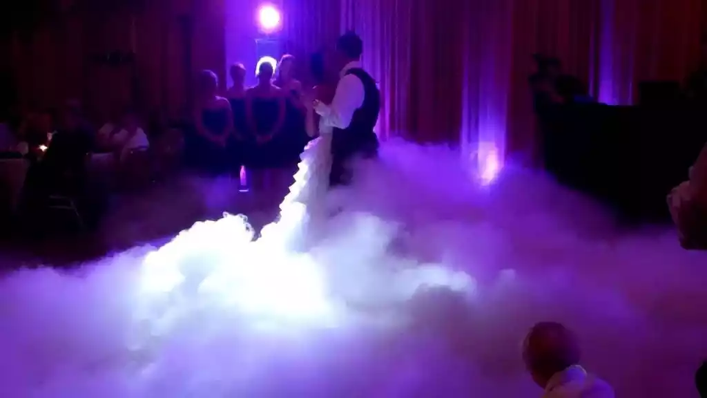 Bride and groom appear to be dancing on the clouds with a cloud effect