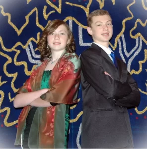 A brother and sister pose for a photo at her bat mitzvah