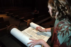 A girl reading the Torah at her Bat Mitzvah