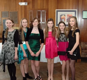 Girls posing for a pic before a bat mitzvah ceremony