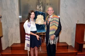 Bat mitzvah holding the Torah
