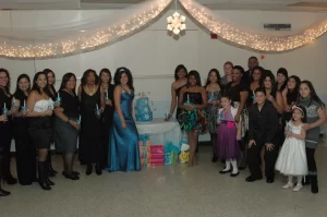 Group photo after candle lighting at a sweet 16 party