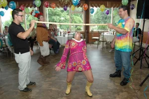 Woman doing limbo at a party