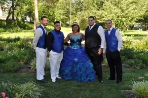 A sweet 16 posing with her brothers 
