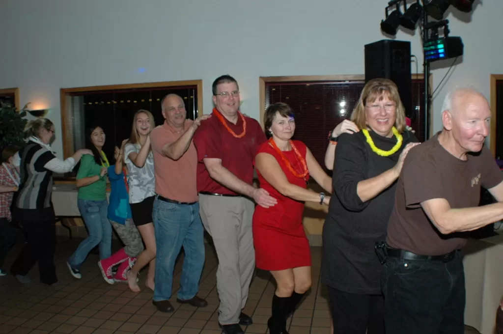 Corporate party conga line full of dancers at a PartyMasterz event