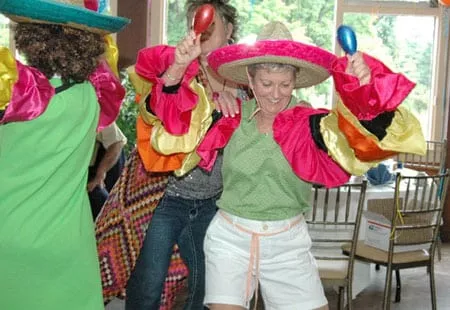 Woman dancing conga dressed in mexican clothing