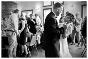 Black and white photo of bride and groom during their first dance