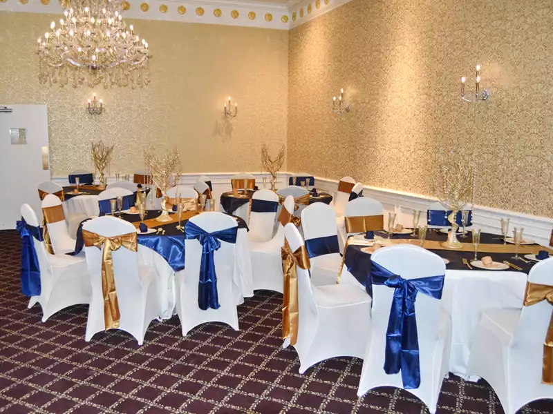 gold and navy linens at a wedding
