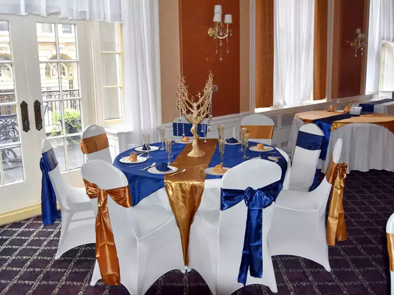 Wedding decor table with navy and gold linen